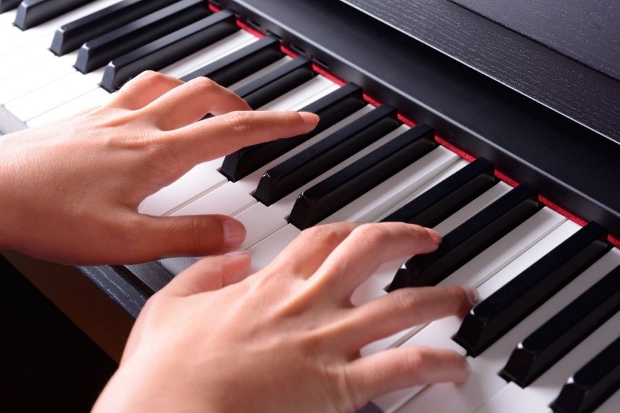both-hands-playing-piano